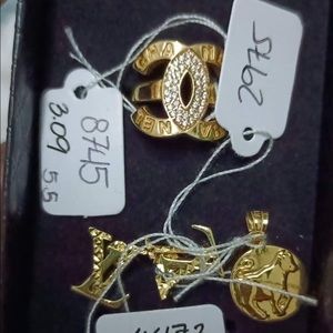 Earring, ring and a taurus pendant